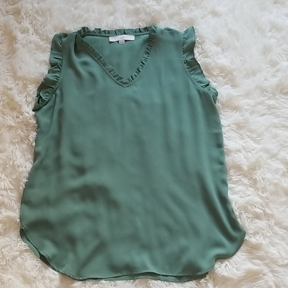 Green blouse.